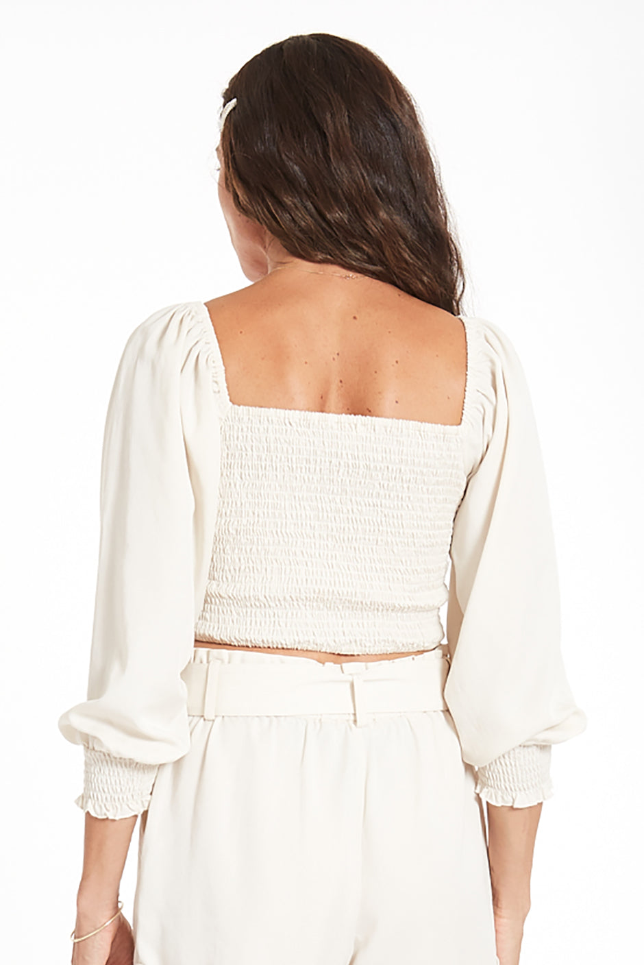 Liv Crop Top in Coconut Milk for women by Paneros Clothing. Square neckline with smocked back and elastic at shoulders, 3/4 length sleeves. 100% Tencel. Back View.