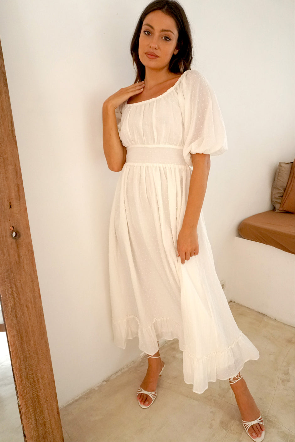 White Cotton Clip Dot Midi Dress for Women with ruffle details, Elbow-length sleeves from Paneros Clothing: the Willow Dress. Front View.