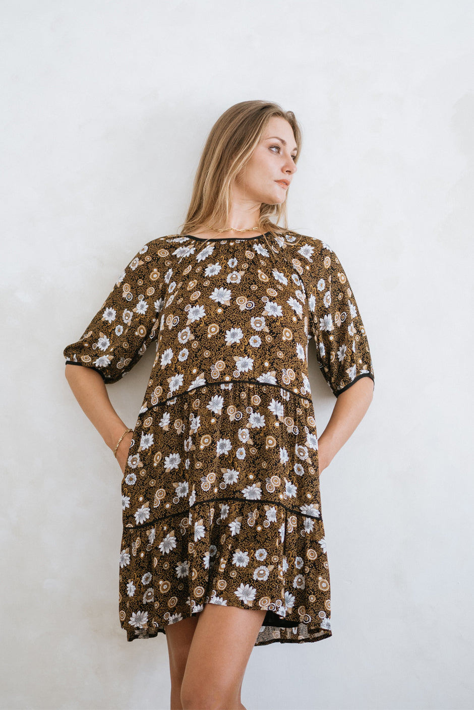 Brown/Tan/Beige Bohemian Floral Paisley Print Spring/Summer 2022 Clover Mini Dress from Paneros Clothing. Front View with tiered skirt/gathered tiers.