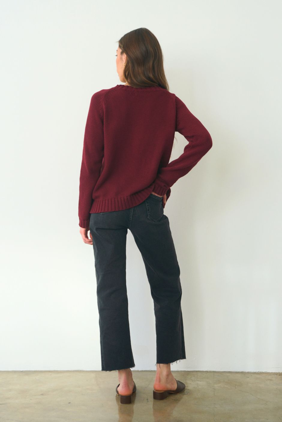 Burgundy sustainable cotton handknitted Sloane Crewneck by Paneros Clothing. Relaxed-fit hip-length crewneck sweater with long sleeves and ribbing details. Back View.