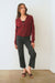 Burgundy sustainable cropped-length Cotton Diana Cardigan from Paneros Clothing with real coconut shell button-up front, Full sleeves, and feminine handknittting. Front View buttoned.