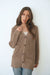 Mocha Brown Sustainable Cotton Hip-Length Button-up Emily Cardigan by Paneros Clothing. Hand-knitted, slightly oversized cardigan with real coconut shell buttons and ribbed detailing. Front View buttoned.