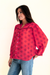 Red Sedona Tile Print Anna Shirt from Paneros Clothing with button-up front and long sleeves. Sustainable rayon dobby shirt blouse in red sedona tile print with contrast navy piping details. Side View untucked.