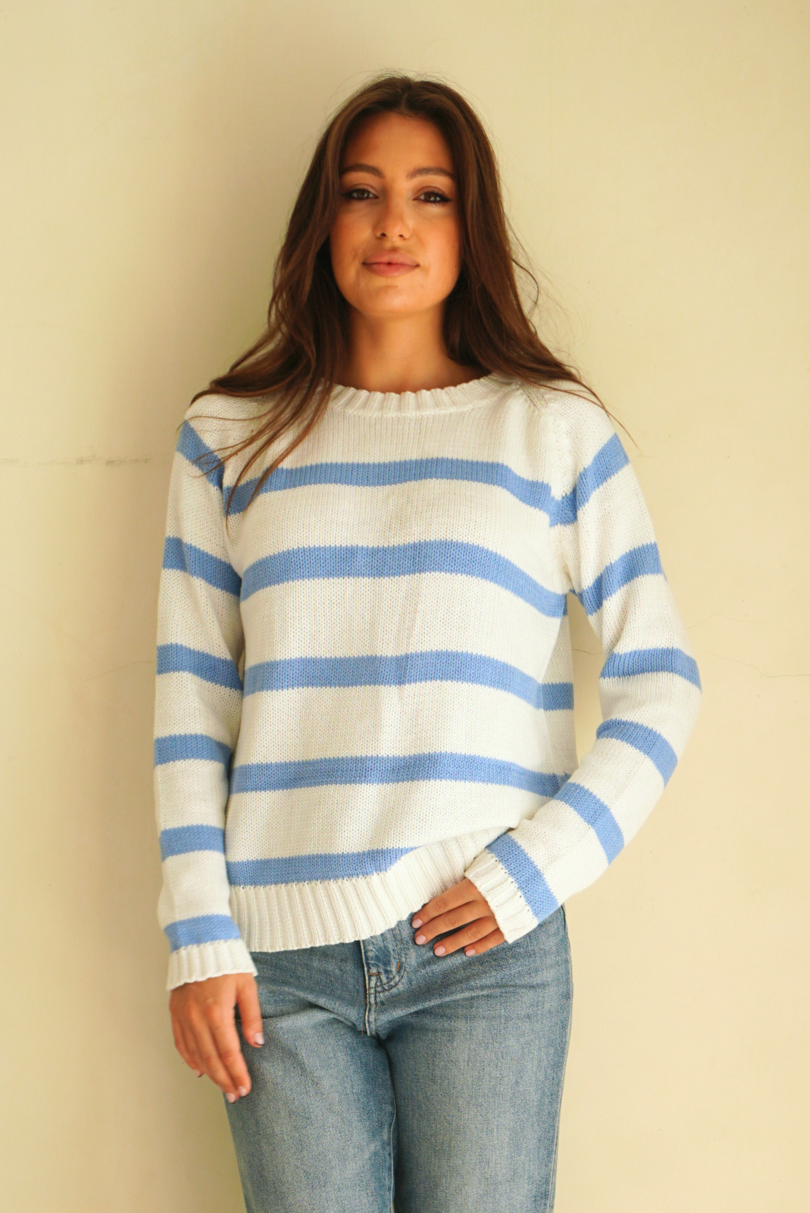 Baby Blue and White Striped sustainable cotton handknitted Sloane Crewneck by Paneros Clothing. Relaxed-fit hip-length crewneck sweater with long sleeves and ribbing details. Front View untucked.