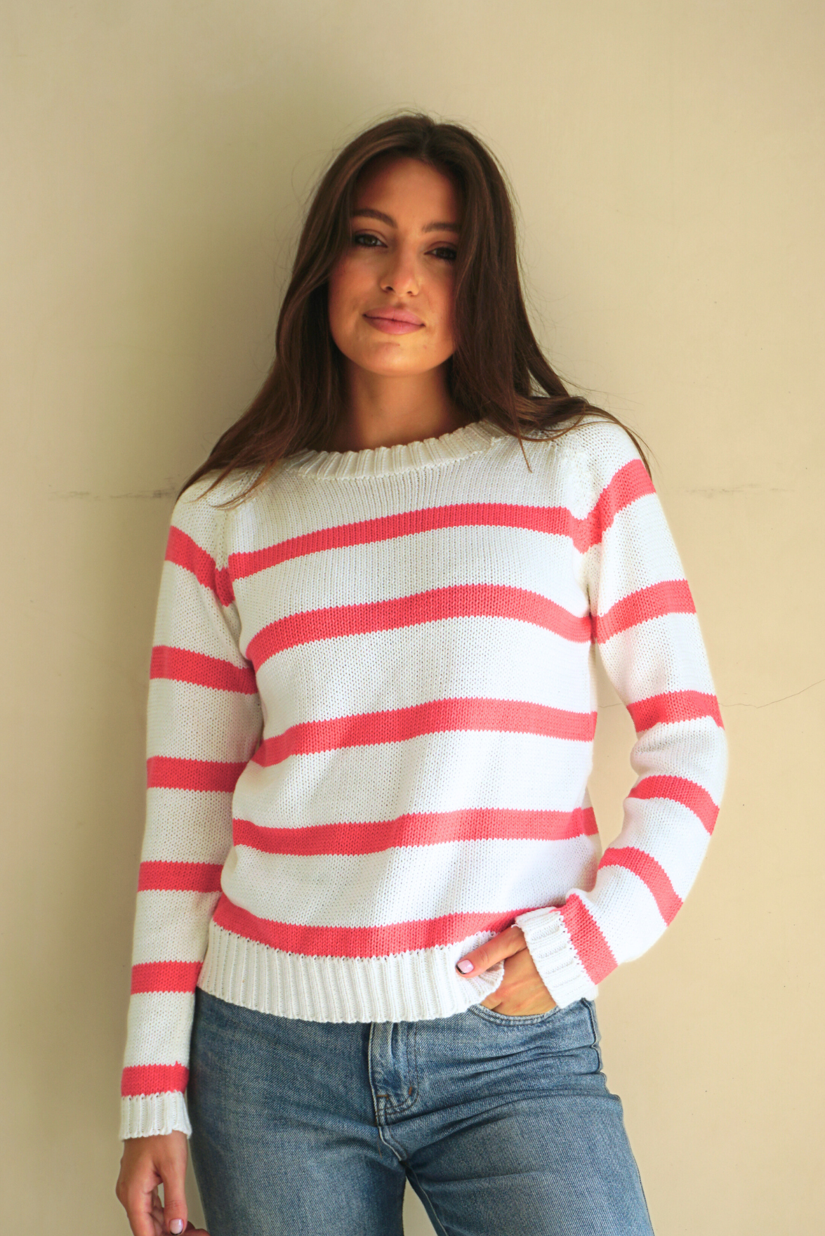 Hot Pink and White Striped sustainable cotton handknitted Sloane Crewneck by Paneros Clothing. Relaxed-fit hip-length crewneck sweater with long sleeves and ribbing details. Front View untucked.