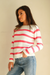 Hot Pink and White Striped sustainable cotton handknitted Sloane Crewneck by Paneros Clothing. Relaxed-fit hip-length crewneck sweater with long sleeves and ribbing details. Front/Side View.