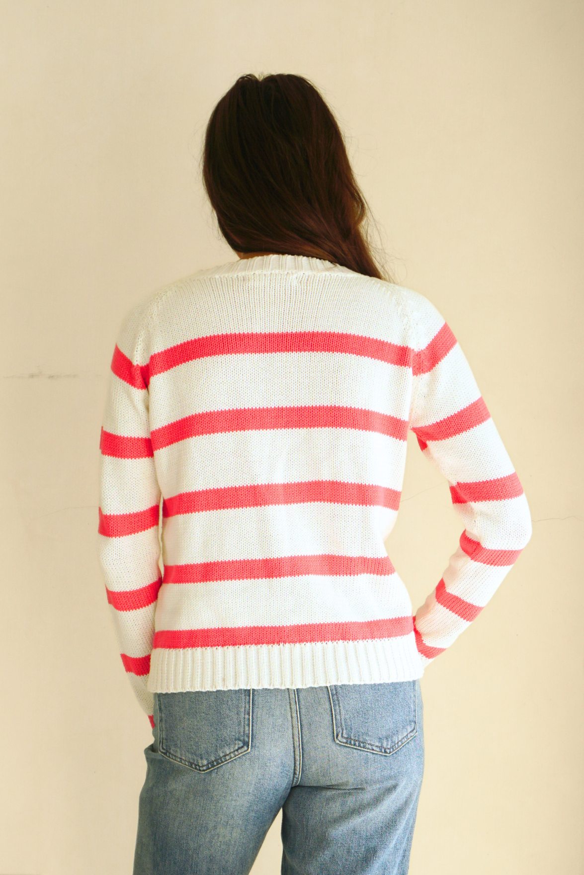 Hot Pink and White Striped sustainable cotton handknitted Sloane Crewneck by Paneros Clothing. Relaxed-fit hip-length crewneck sweater with long sleeves and ribbing details. Back View.