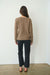 Brown sustainable cotton handknitted Sloane Crewneck by Paneros Clothing. Relaxed-fit hip-length crewneck sweater with long sleeves and ribbing details. Back View.