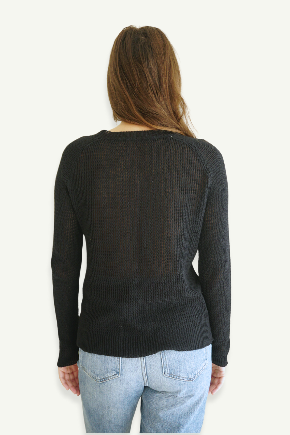 Black sustainable cotton handknitted Openwork Sloane Crewneck by Paneros Clothing. Relaxed-fit hip-length crochet crewneck sweater with long sleeves and ribbing details. Back View.