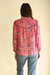 Pink Floral Print Anna Shirt from Paneros Clothing with button-up front and long sleeves. Sustainable rayon dobby shirt blouse in pink floral print with contrast navy piping details. Back View.