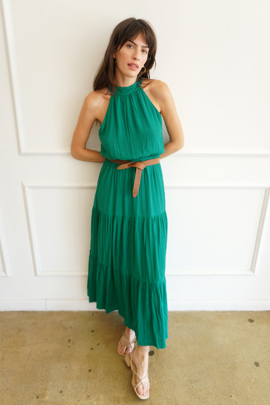 Emerald Green Sustainable Maxi Dress from Paneros Clothing: the Gia. Halter neckline, elastic at the waist, with ruffles.  Front View. 
