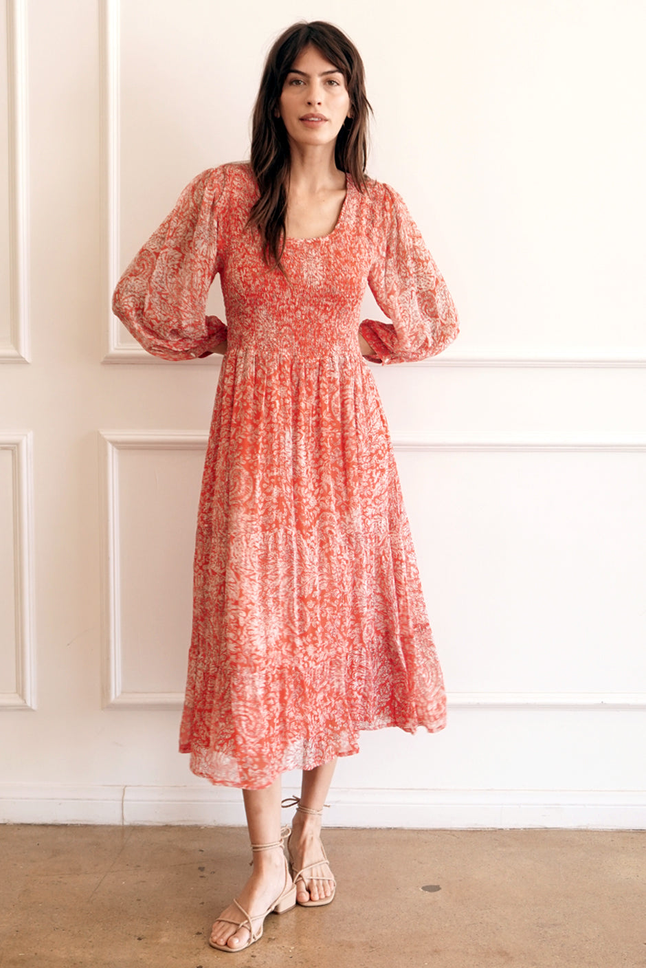 Chili Red Floral Print Sustainable Midi Dress from Paneros Clothing: the Stella Dress. Full ruffle sleeves, with smocking and flowy skirt.  Front View.