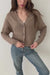 Mocha Brown sustainable cropped-length Cotton Diana Cardigan from Paneros Clothing with real coconut shell button-up front, Full sleeves, and feminine handknittting. Front/Side View in motion, buttoned.