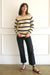 Tan and Black Striped sustainable cotton handknitted Sloane Crewneck by Paneros Clothing. Relaxed-fit hip-length crewneck sweater with long sleeves and ribbing details. Front View untucked.