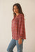 Red Boho Print Spring/Summer 2023 Anna Shirt from Paneros Clothing with button-up front and long sleeves. Side View.