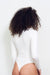 Claudia Bodysuit in White Cloud Color for women by Paneros Clothing. Long Sleeve crew neck thong back in bamboo. Back View.