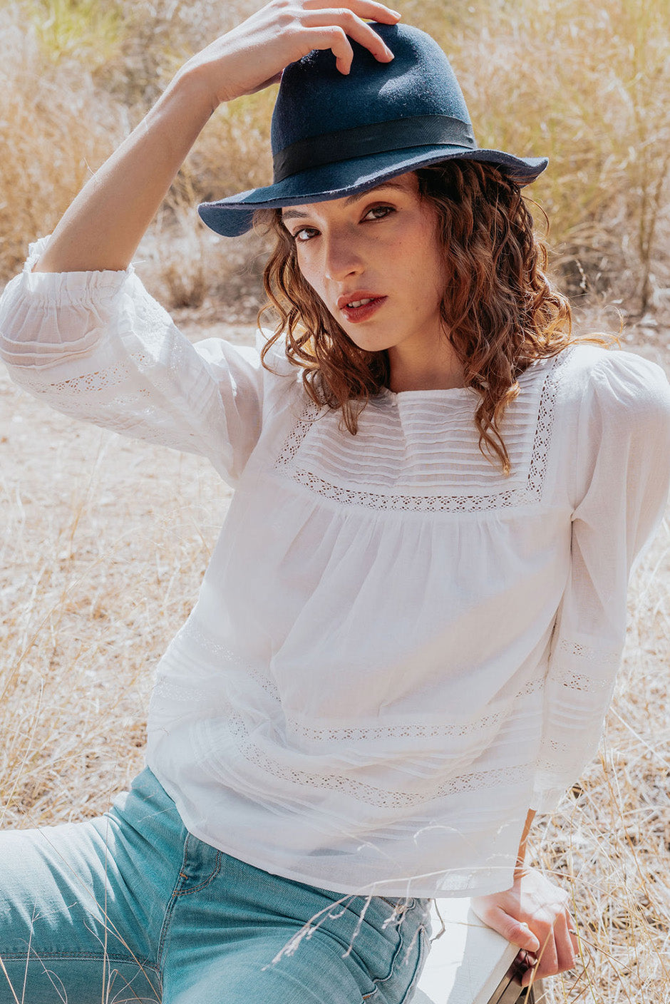 Cloud White Long Sleeve Dawn Blouse for women by Paneros Clothing. Handmade from soft cotton voile with pin tucks and lace trim. Front View.