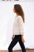 Cloud White Long Sleeve Dawn Blouse for women by Paneros Clothing. Handmade from soft cotton voile with pin tucks and lace trim. Side View.