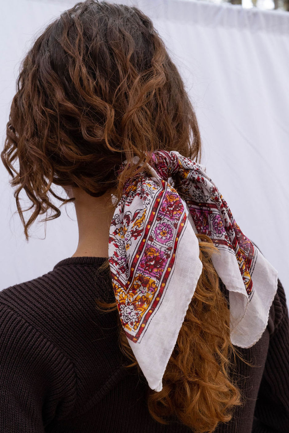 Vintage Freya bandana in White handcrafted in India Featuring a multicolor paisley print for women by Panero Clothing. Hair tied view.