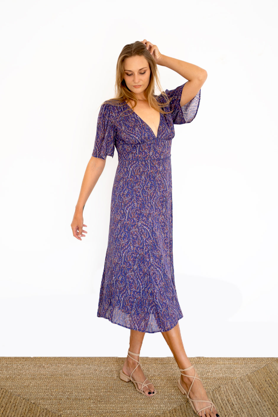 Purple Boho Print Spring/Summer 2022 Aurora Midi Dress from Paneros Clothing with V-neckline and mid sleeves and Piping detail. Side View.