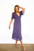 Purple Boho Print Spring/Summer 2022 Aurora Midi Dress from Paneros Clothing with V-neckline and mid sleeves and Piping detail. Side View.