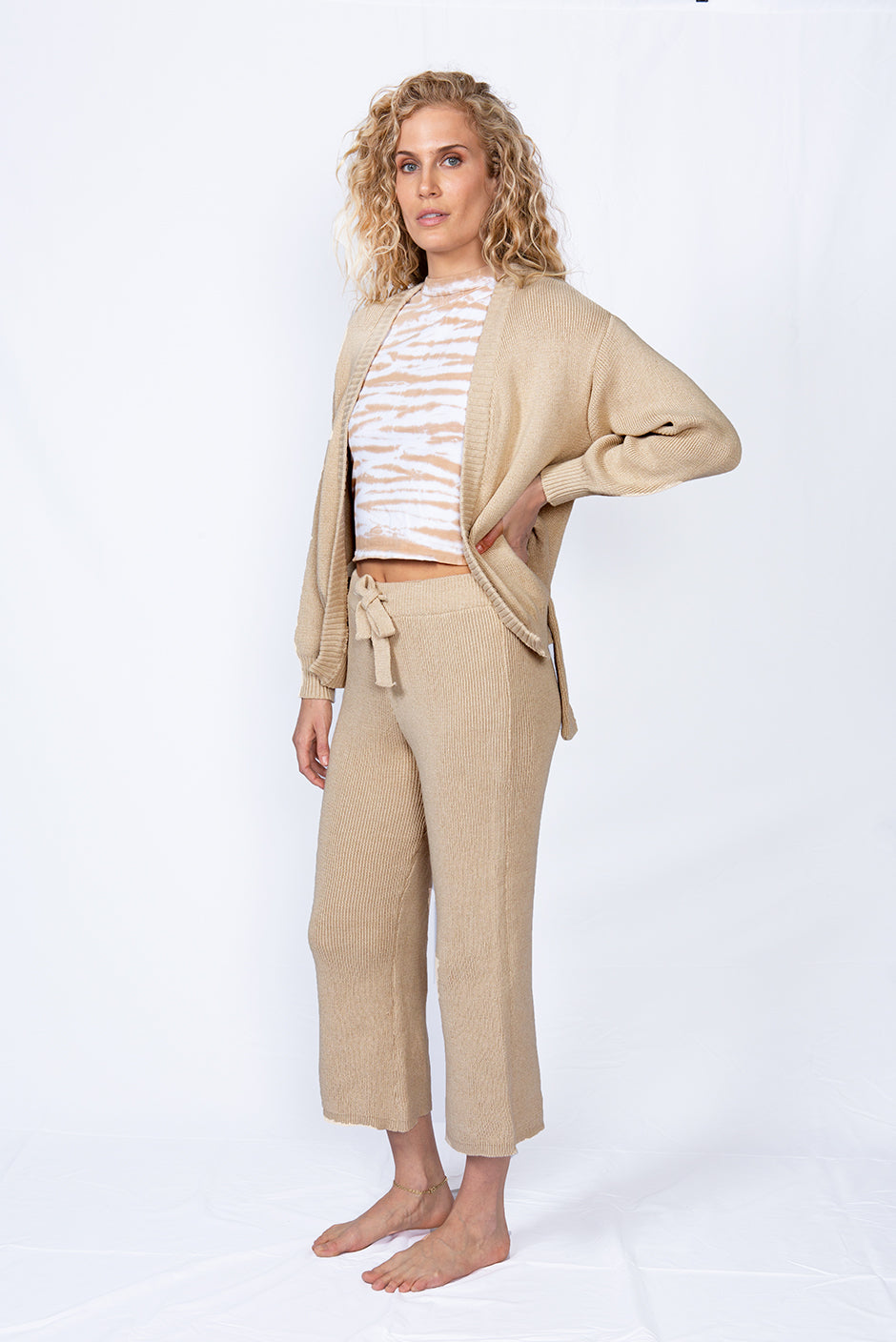 Haley Cardigan in Sand Color for women by Paneros Clothing. Made from sustainable cotton, with waist sash. Side view.