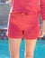 Ivy Short in Roseglow color for women by Paneros Clothing. Handmade from sustainable cotton with elastic and tied waist, and loose legs. Zoomed in front view.