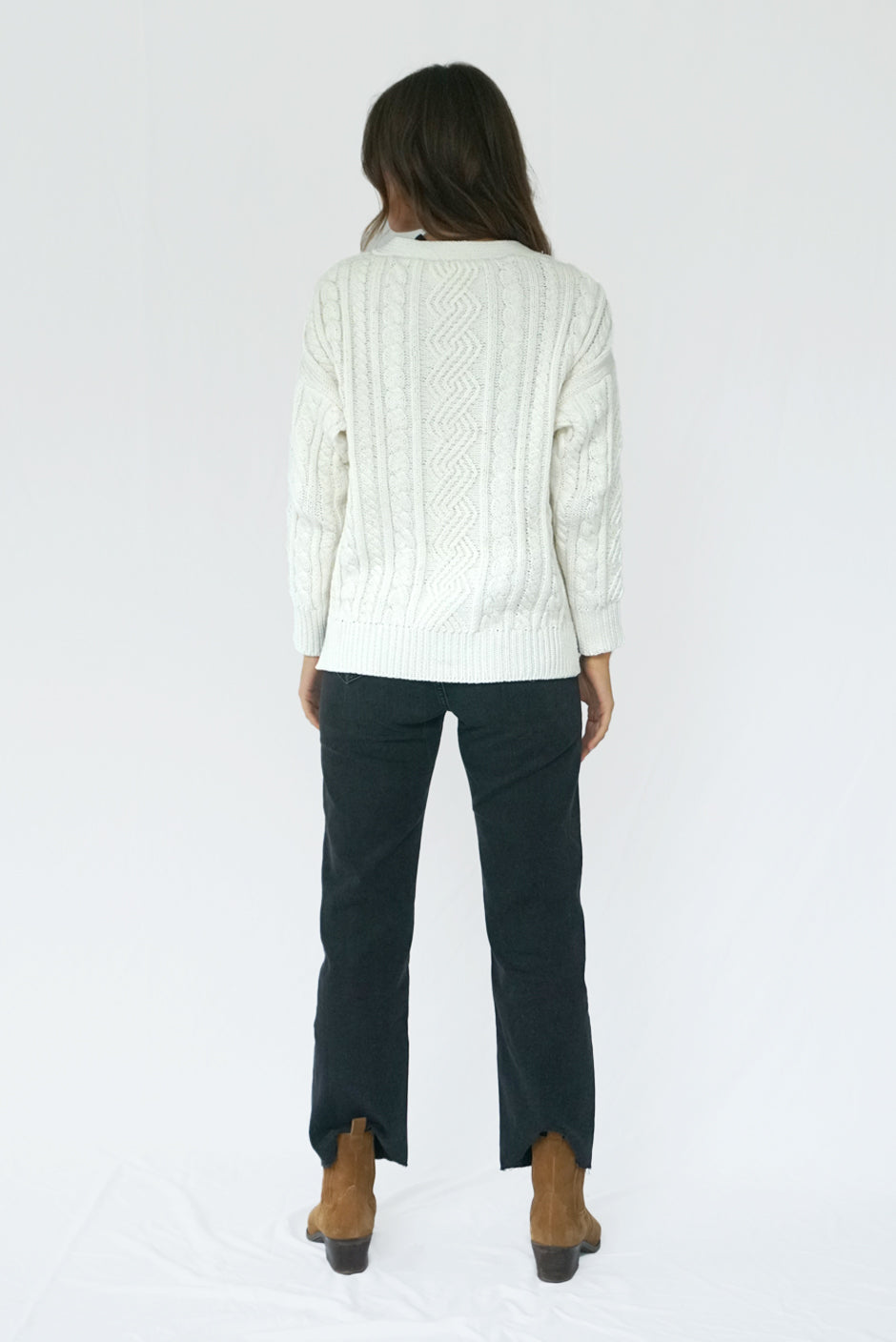 Off-White Long Sleeve Women's Cable-knit Button-up Cardigan Sweater from Paneros Clothing with 100% certified sustainable Cotton and handknitting. Back View.