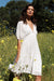 Paneros Clothing - Sustainable Fashion Ethical Designer White Mini Dress for Women - Lifestyle Image.