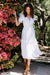 Paneros Clothing - Sustainable Fashion Ethical Designer White Midi Dress for Women - Lifestyle Image.