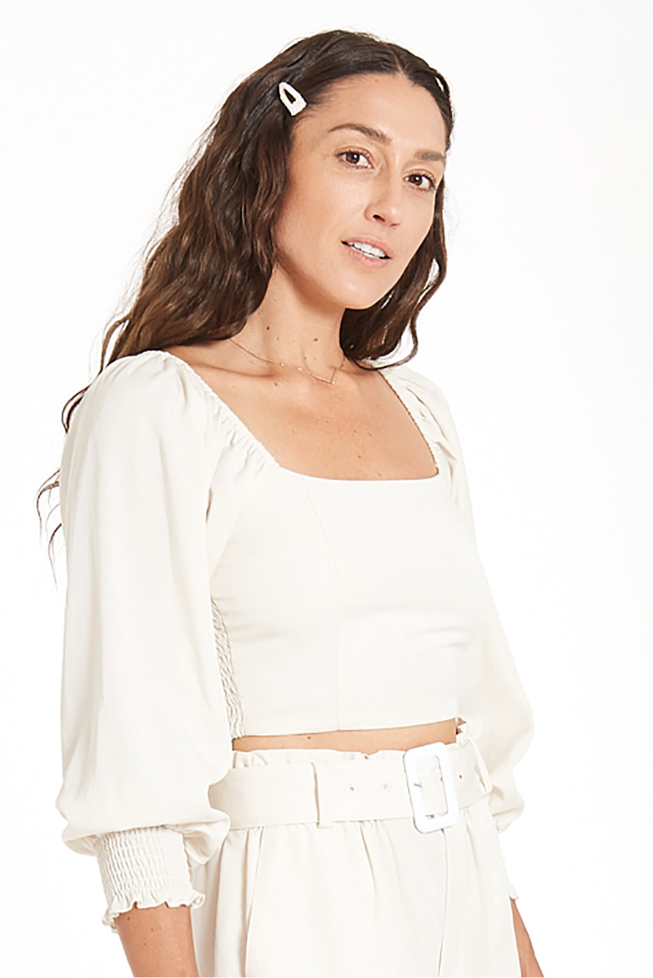 Liv Crop Top in Coconut Milk for women by Paneros Clothing. Square neckline with smocked back and elastic at shoulders, 3/4 length sleeves. 100% Tencel. Side View.