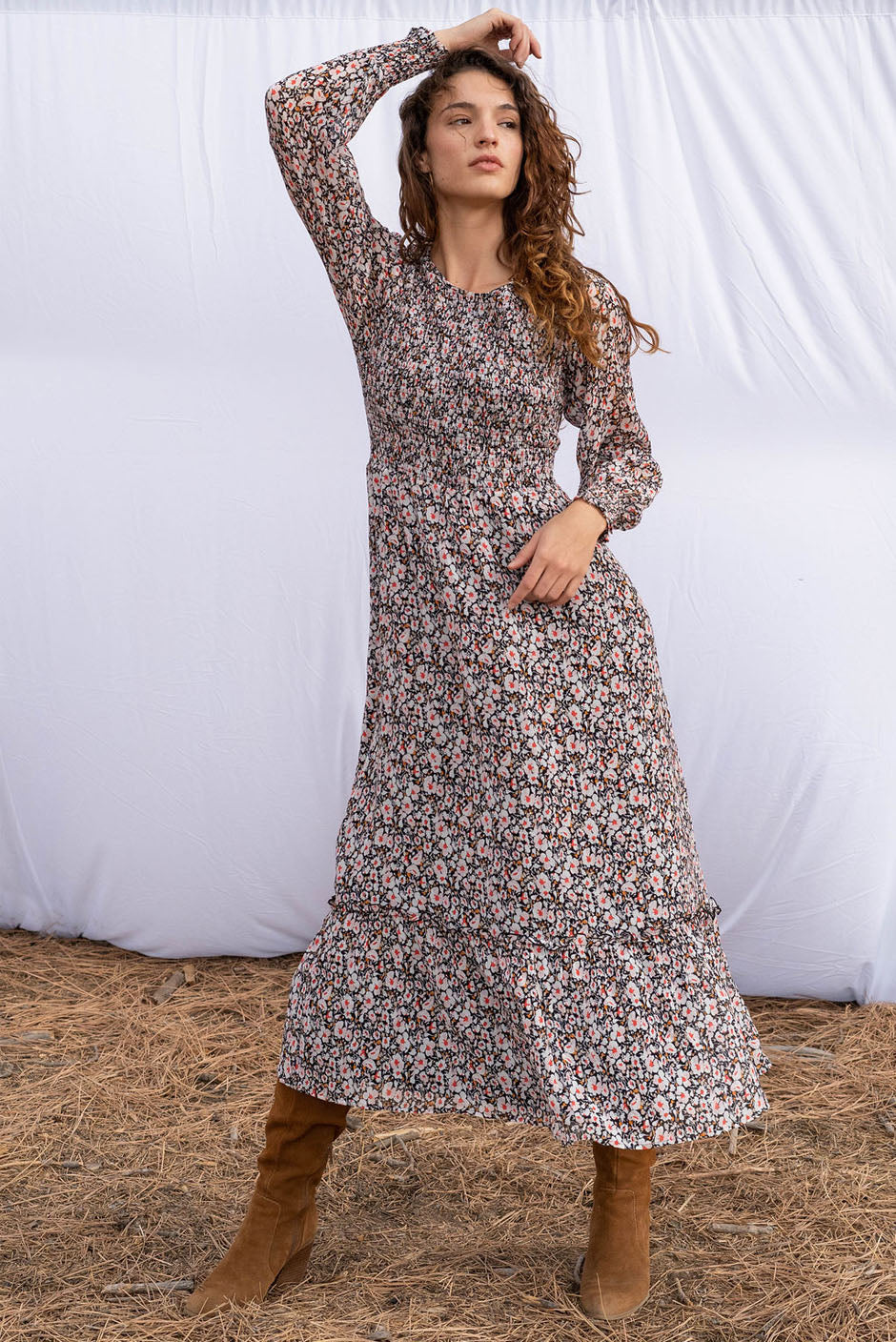 Stella Midi dress in tossed ditsy floral print for women by Paneros Clothing. From sustainable deadstock silk fabric, with smocking ruffles and sleeves. Front view.