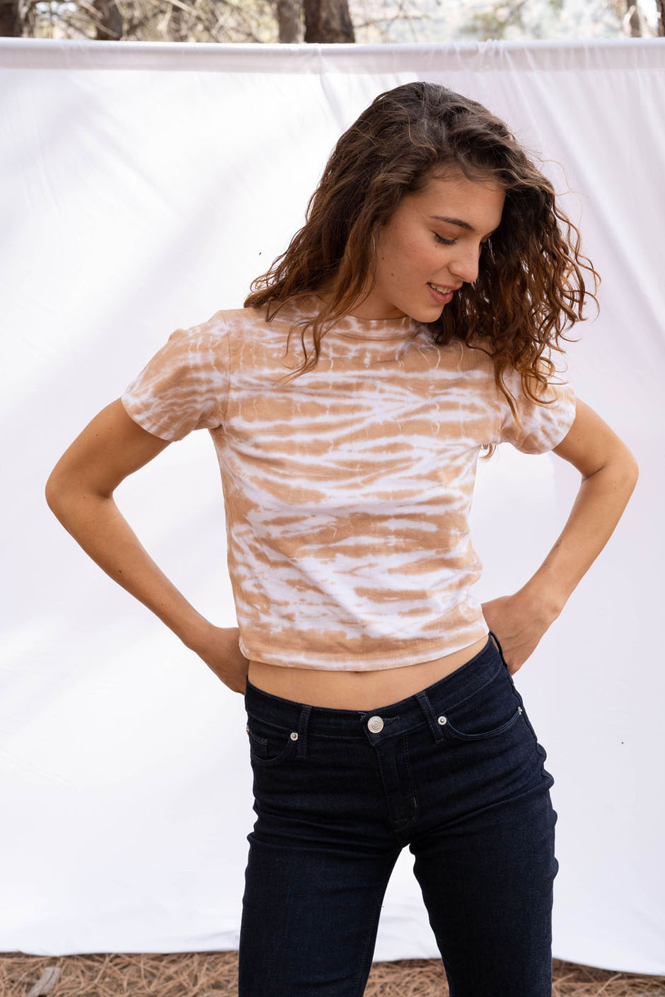 Vintage Cotton Crop Tee in Sand beige color for women by Paneros Clothing. Hand tie-dyed casual top from sustainable cotton. Front View close up styled with jeans.