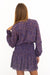 Purple Boho Print Spring/Summer 2022 Aria Blouse from Paneros Clothing with V-neckline and long sleeves. Back View with Stretchy Smocking tucked into Skirt.